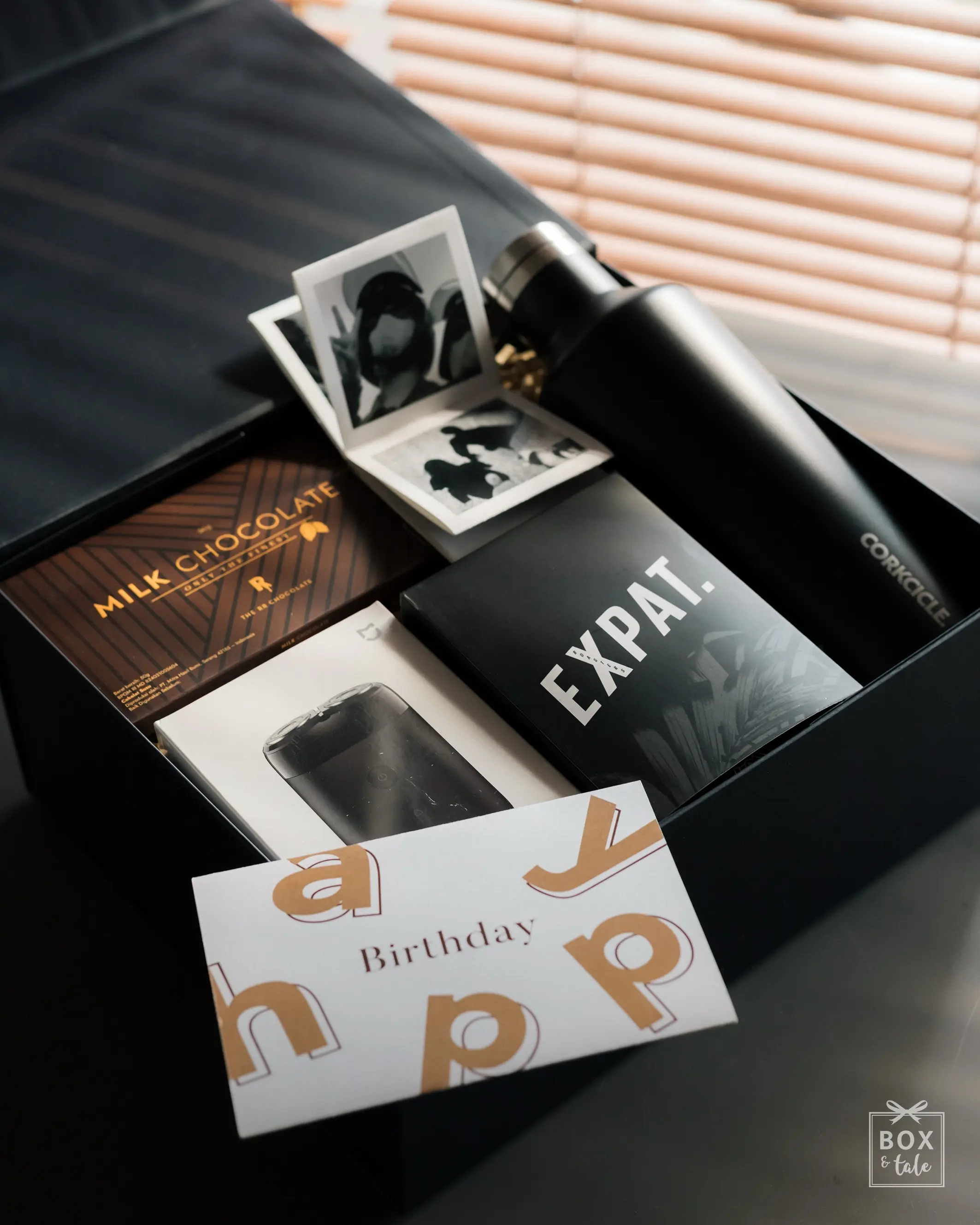Birthday gift for him, but make it a little bit of everything he likes. Swipe to see what made the cut. →

Something he’ll use every day, something for his morning coffee, something sweet… and a photo album full of moments worth keeping.

Then put his name on the box, just in case it wasn’t personal enough already. Happy birthday, Nathan!

Because in the end,it’s not just a gift. It’s his gift.
Find more custom gift ideas at boxandtale.com.